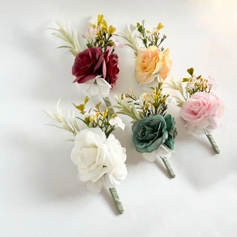 Silk rose lapel pin set in five colors with green stems and white accents