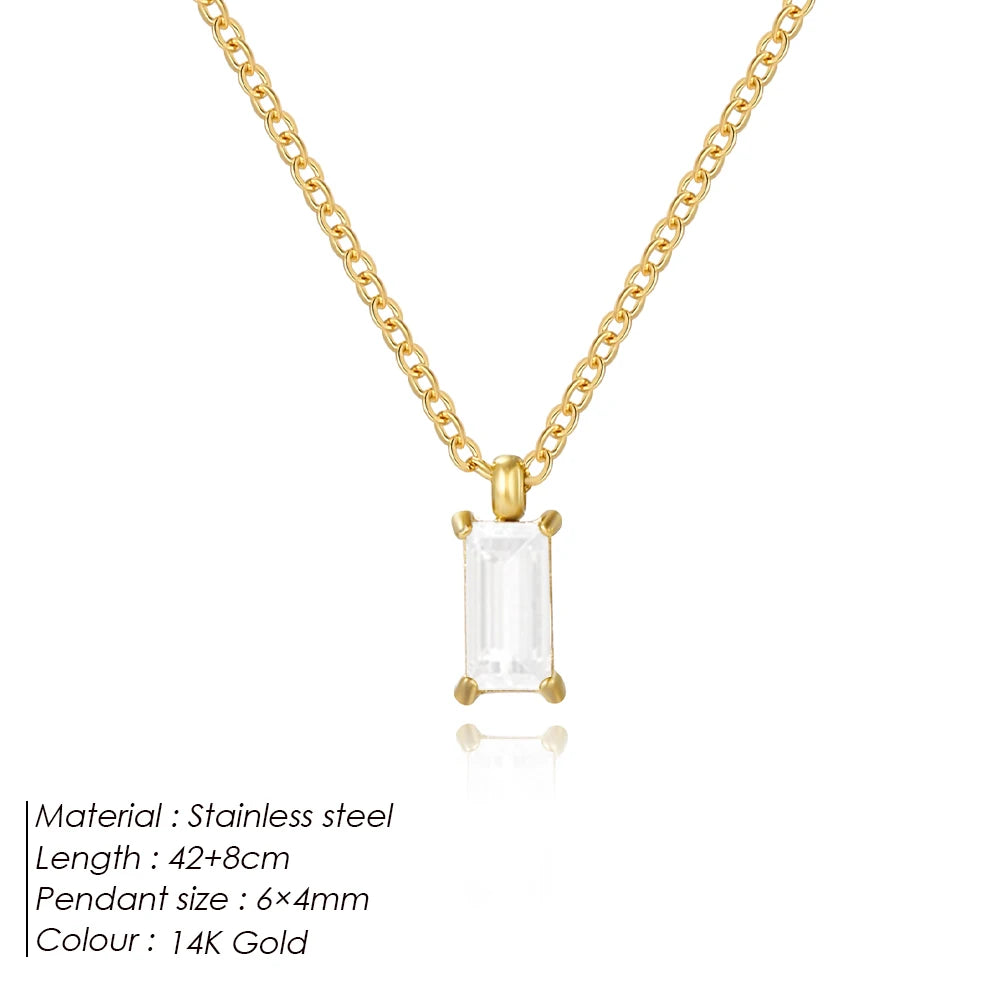Gold-tone link chain necklace with baguette drop pendant and gold settings