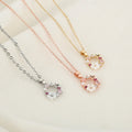 Floral wreath butterfly pendant necklace set in silver, rose gold, and gold tones