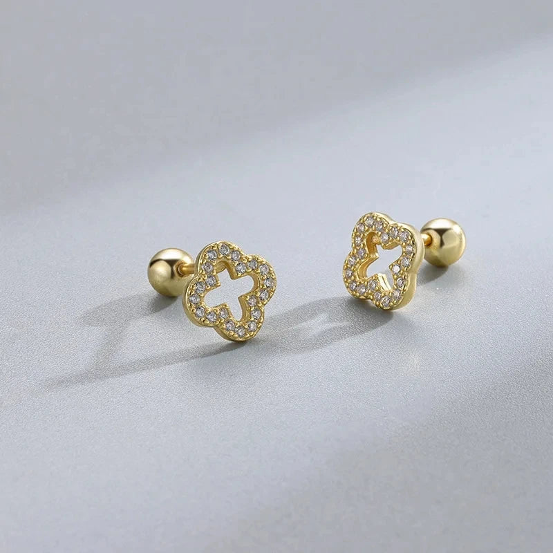 Gold stud earrings with four-leaf clover crystal accents
