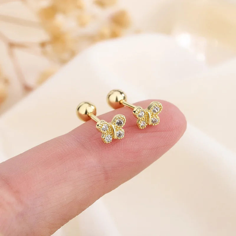 Gold butterfly stud earrings with clear sparkle details, ball posts