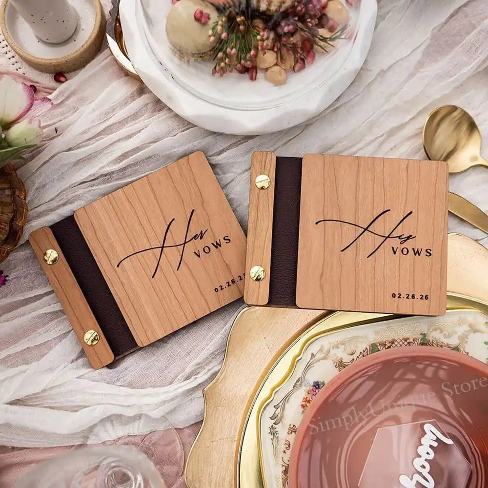 Pair of personalized wooden wedding vow books with black spine and gold hinges