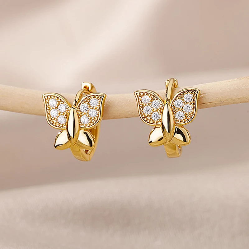 Gold butterfly stud earrings with clear stones