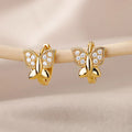 Gold butterfly stud earrings with clear stones