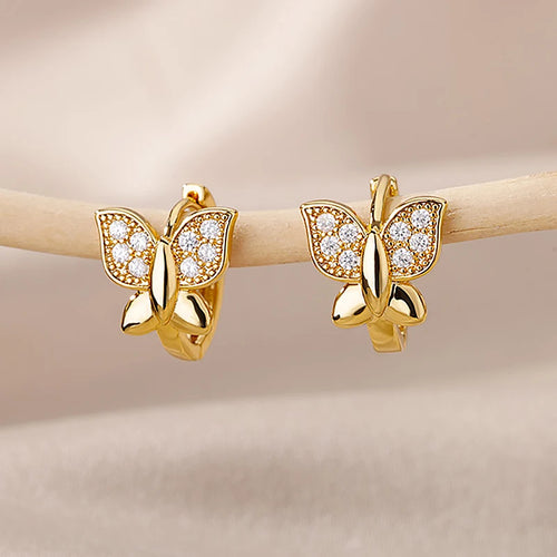 Gold butterfly stud earrings with clear stones