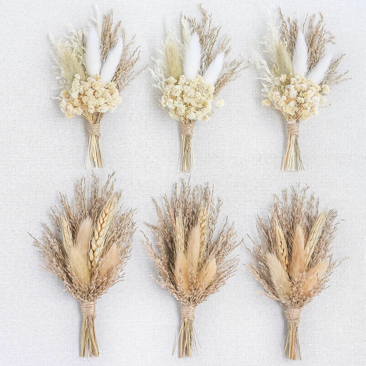 Set of dried flower boutonnieres with wheat stalk bundles and small cream blossoms