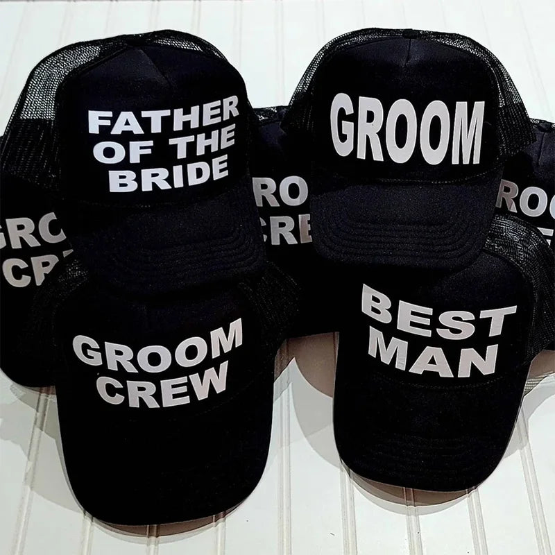 Black mesh trucker caps set with white text: FATHER OF THE BRIDE, GROOM, BEST MAN