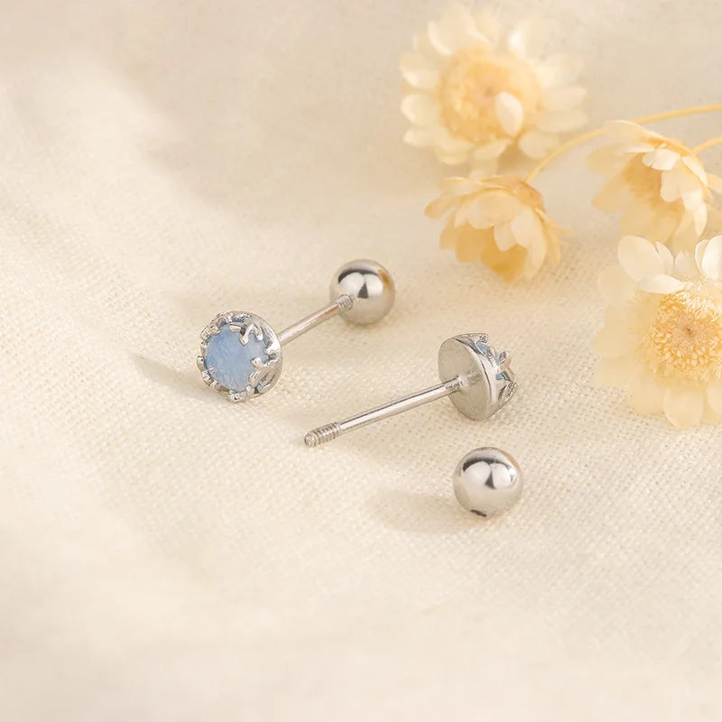 Silver stud earrings with small blue crystal center and round ball posts