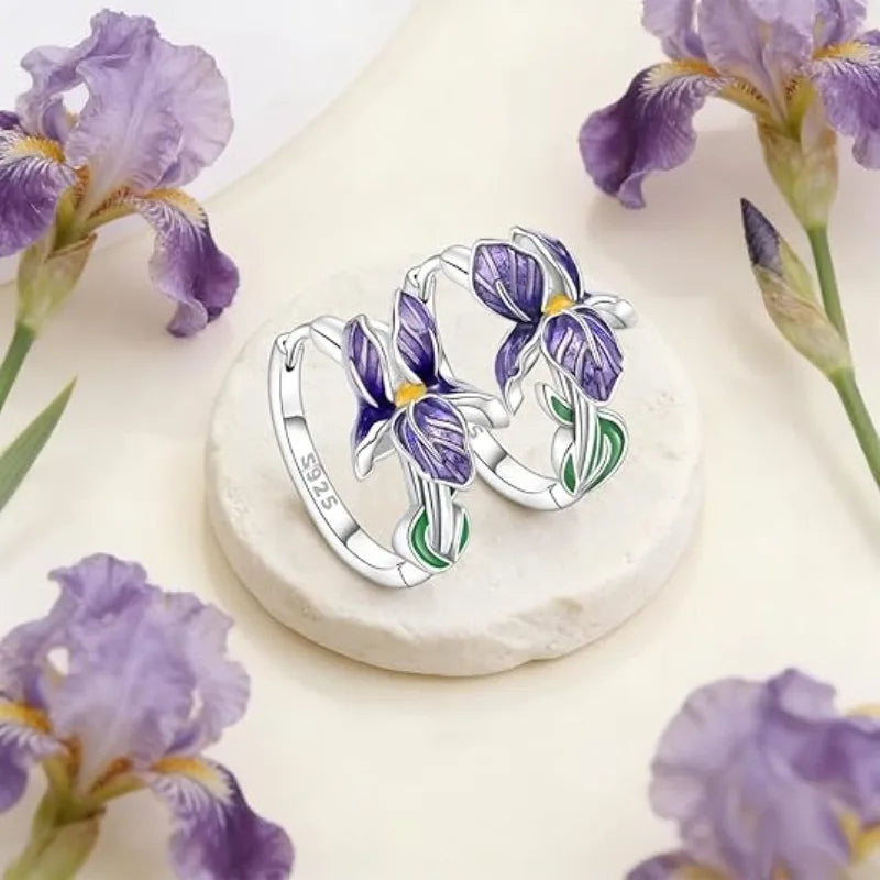 Sterling silver huggie earrings showing purple iris petals with green leaves, small hoop pair