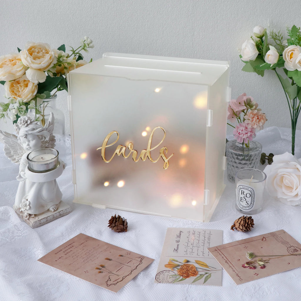 White frosted acrylic wedding card box with 'Cards' and warm LED glow, on table