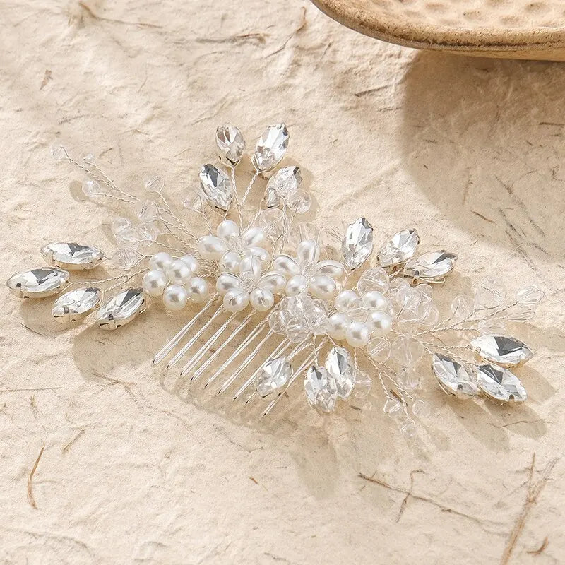 Bridal hair comb with pearl and crystal leaf design, set on a long comb base