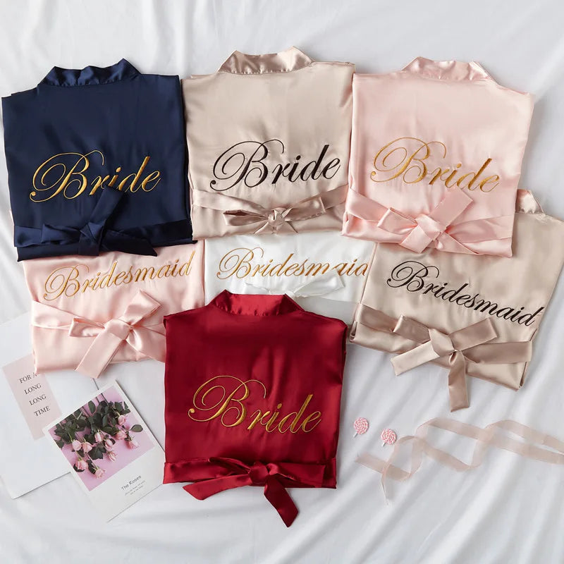Satin bridal robe set in navy, blush, light pink, and red with embroidered Bride