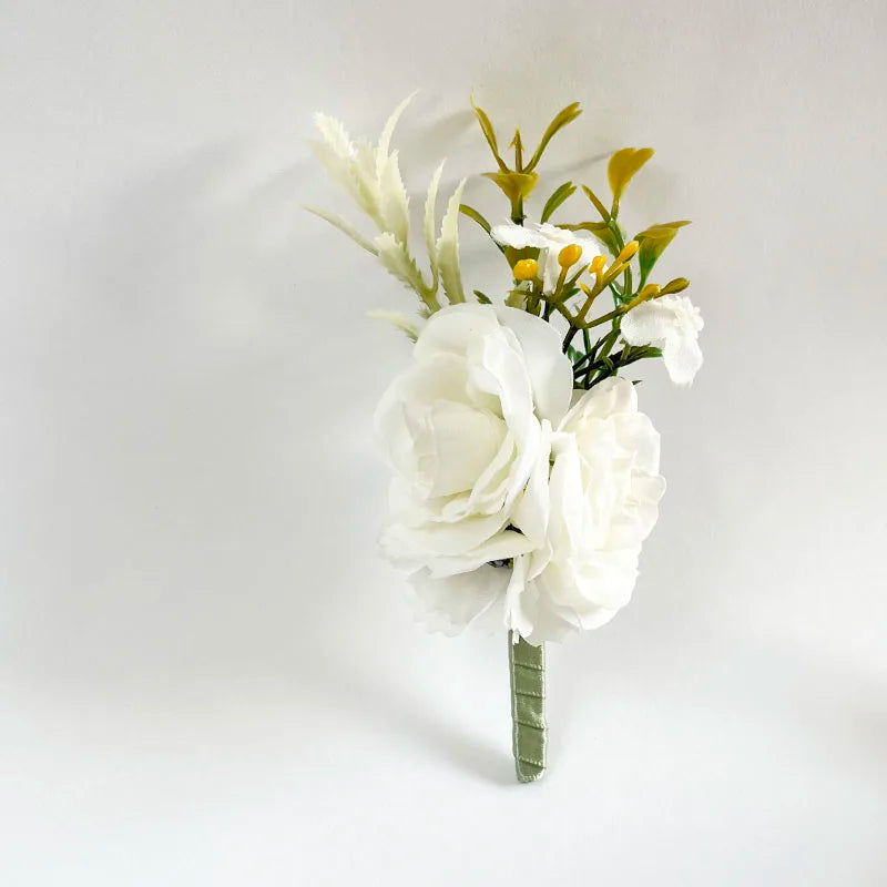 Silk rose boutonniere with white flowers and green-yellow sprigs