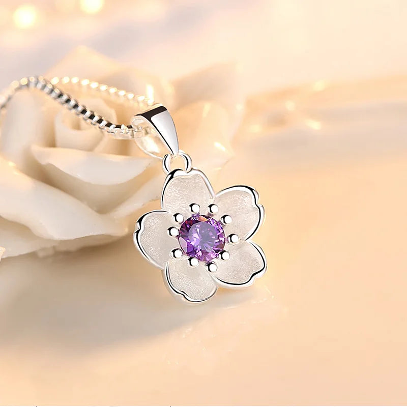 Sterling silver flower crystal pendant necklace with round pink center and purple gem