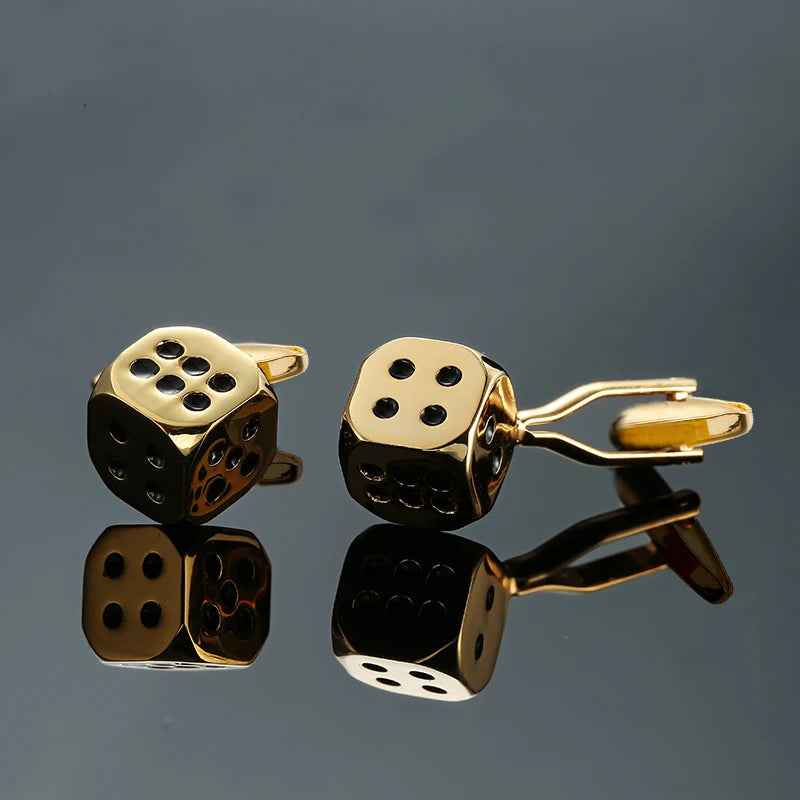 Cuff-link set with golden dice designs, black inset dots, hinged cuff backs