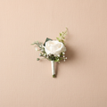 Ivory silk rose boutonniere with green sprigs and wrapped stem
