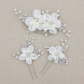 White floral hair set with rhinestone centers, faux pearl sprigs, and comb with pins