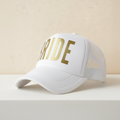 White trucker cap with gold “BRIDE” front print and white mesh side panels
