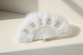 Bride hand fan with white feather plume, rhinestone pearl letters and ribbon handle loop