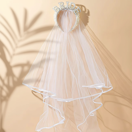 Bride-to-be pearl veil with “BRIDE” crown top and flowing white tulle, blue-trim hem