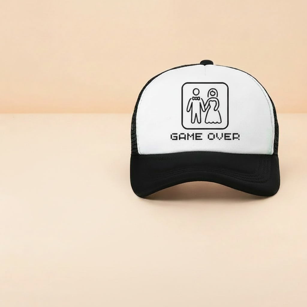 Black and white trucker cap with "Game Over" logo panel
