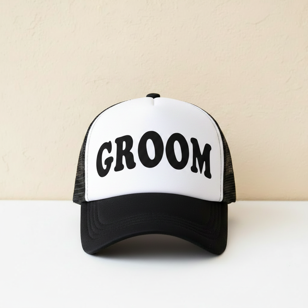 White and black trucker cap with bold “GROOM” front text and black mesh back