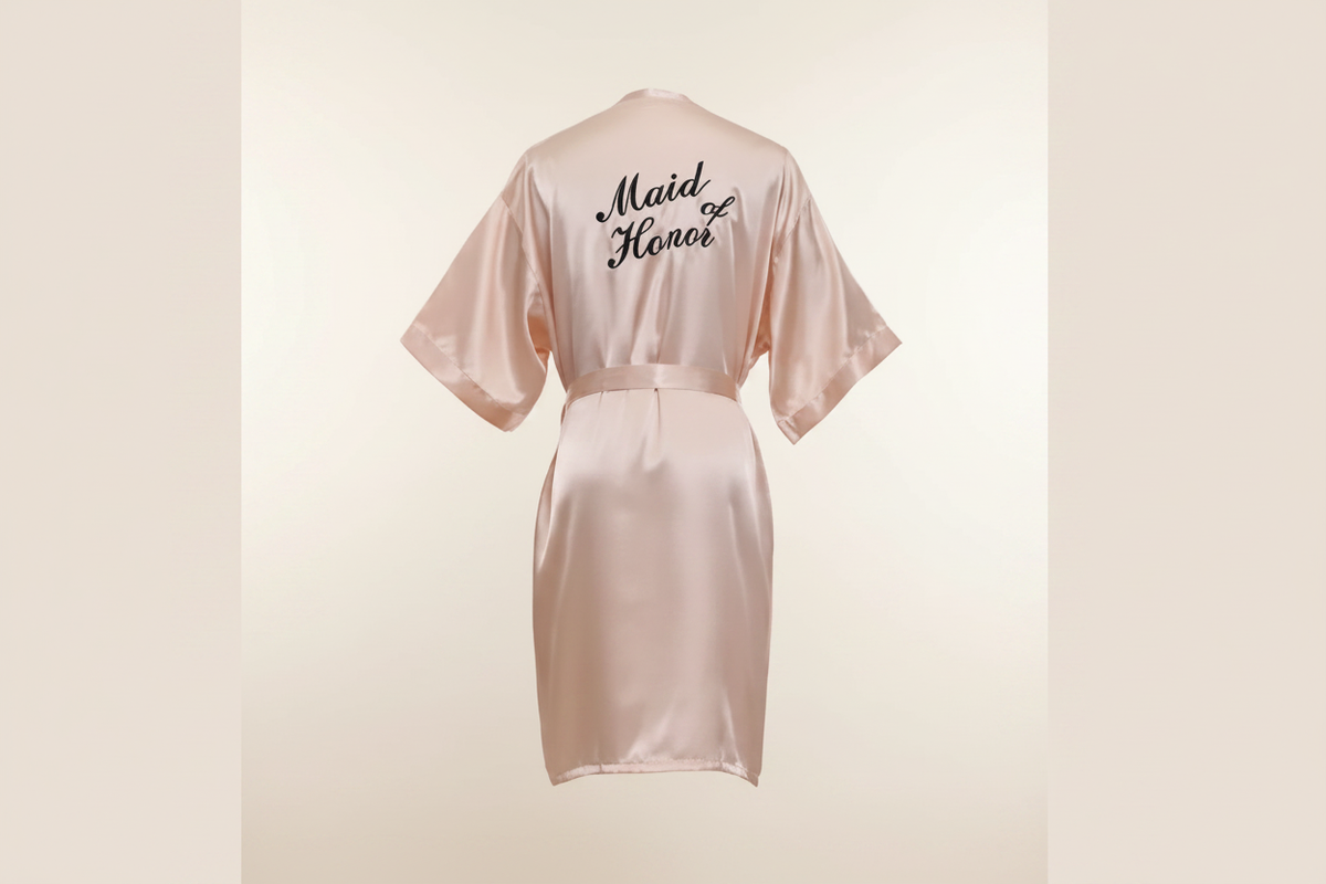 Pink satin robe with belt tie and 'Maid of Honor' embroidery on back