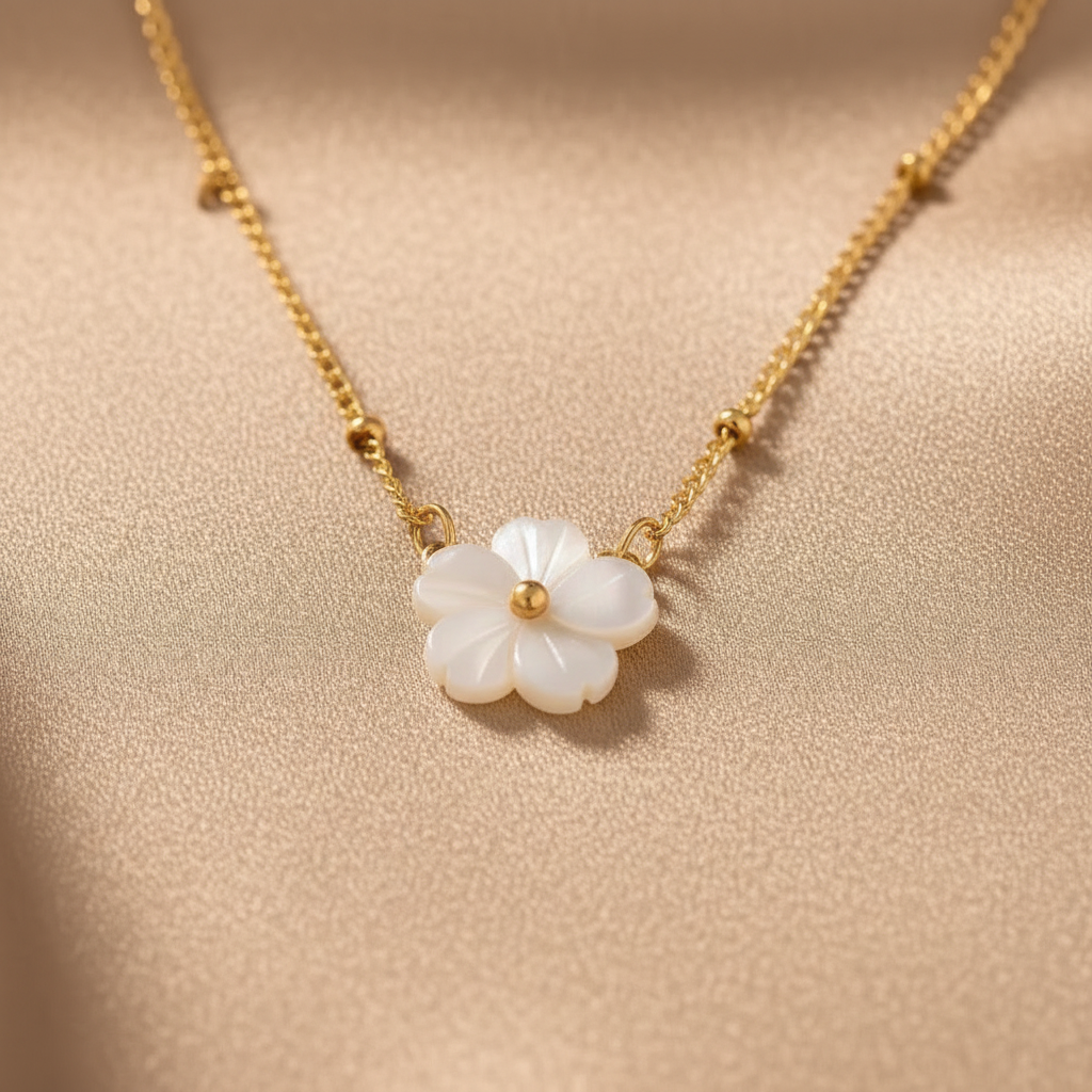 Gold-color chain necklace with white flower pearl pendant, small gold accents