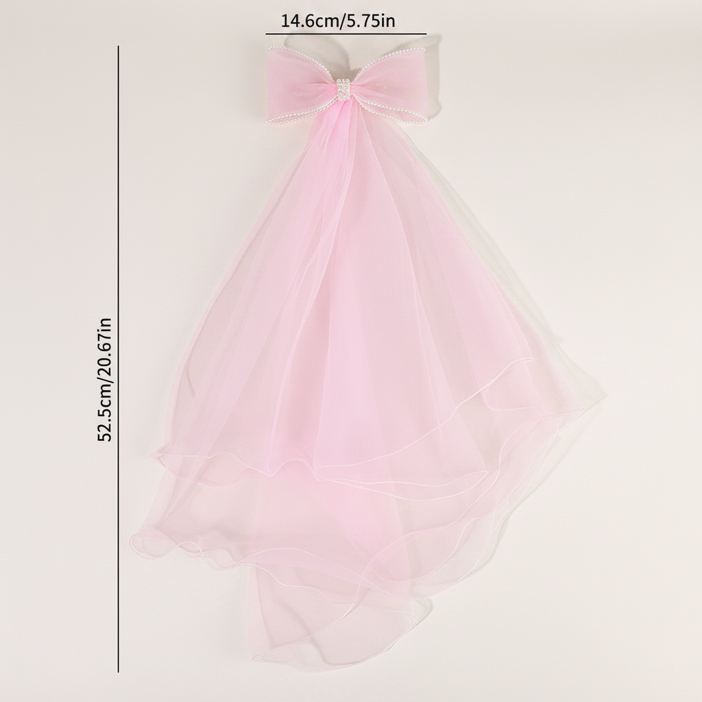 Pink tulle veil barrette with bow top and flowing layered sheer layers