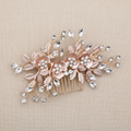 Bridal hair comb with blush leaves, white flowers, and clear crystal sprigs