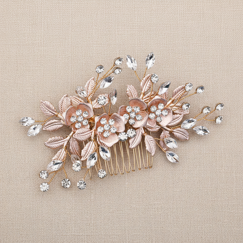 Bridal hair comb with blush leaves, white flowers, and clear crystal sprigs