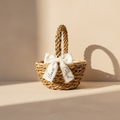 Handmade seagrass flower girl basket with white ribbon bow and carrying handle
