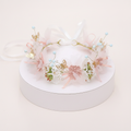 Bridal flower halo crown with pastel pink blooms, gold butterfly accents, light blue beads