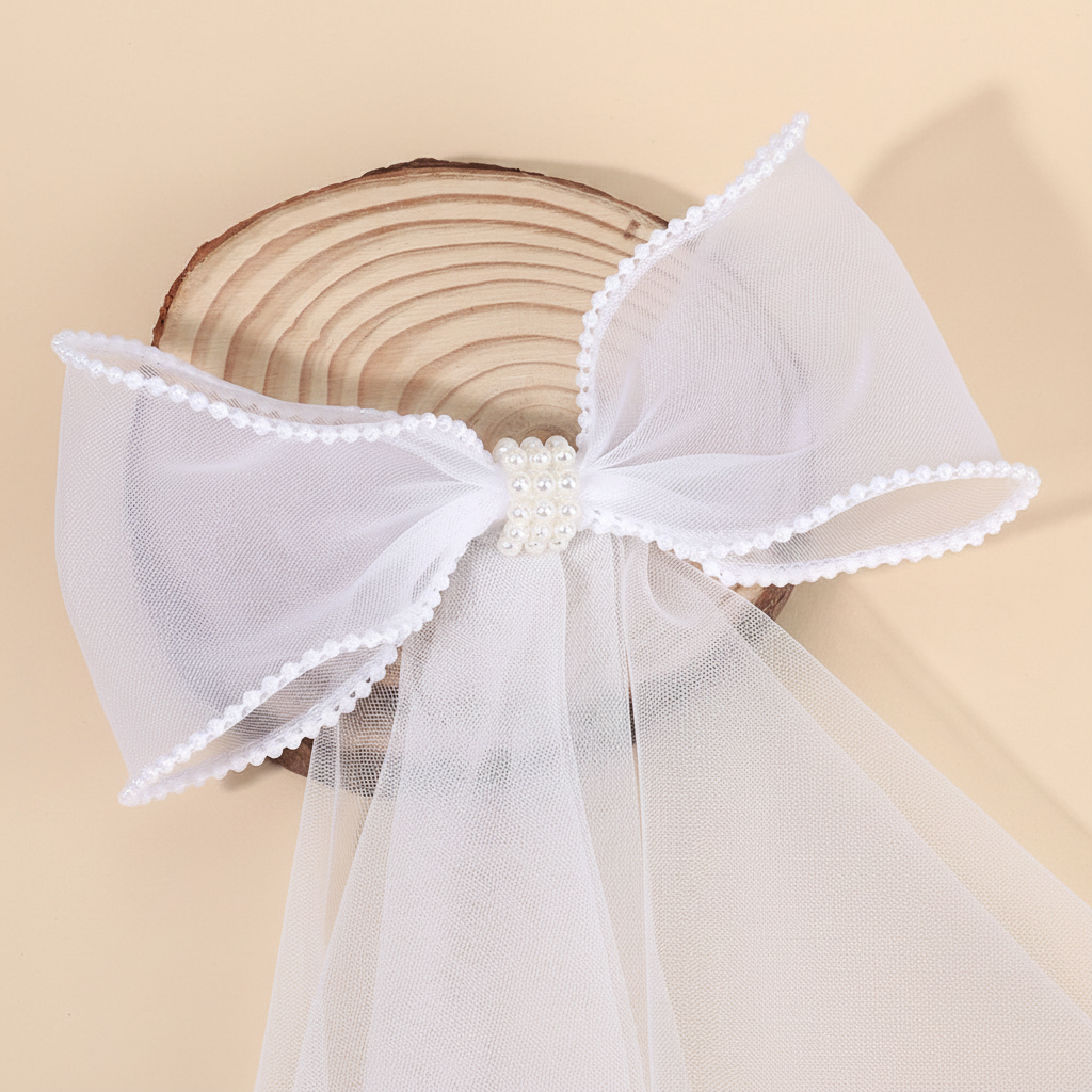 White tulle bow hair clip with faux pearl edge and center bead
