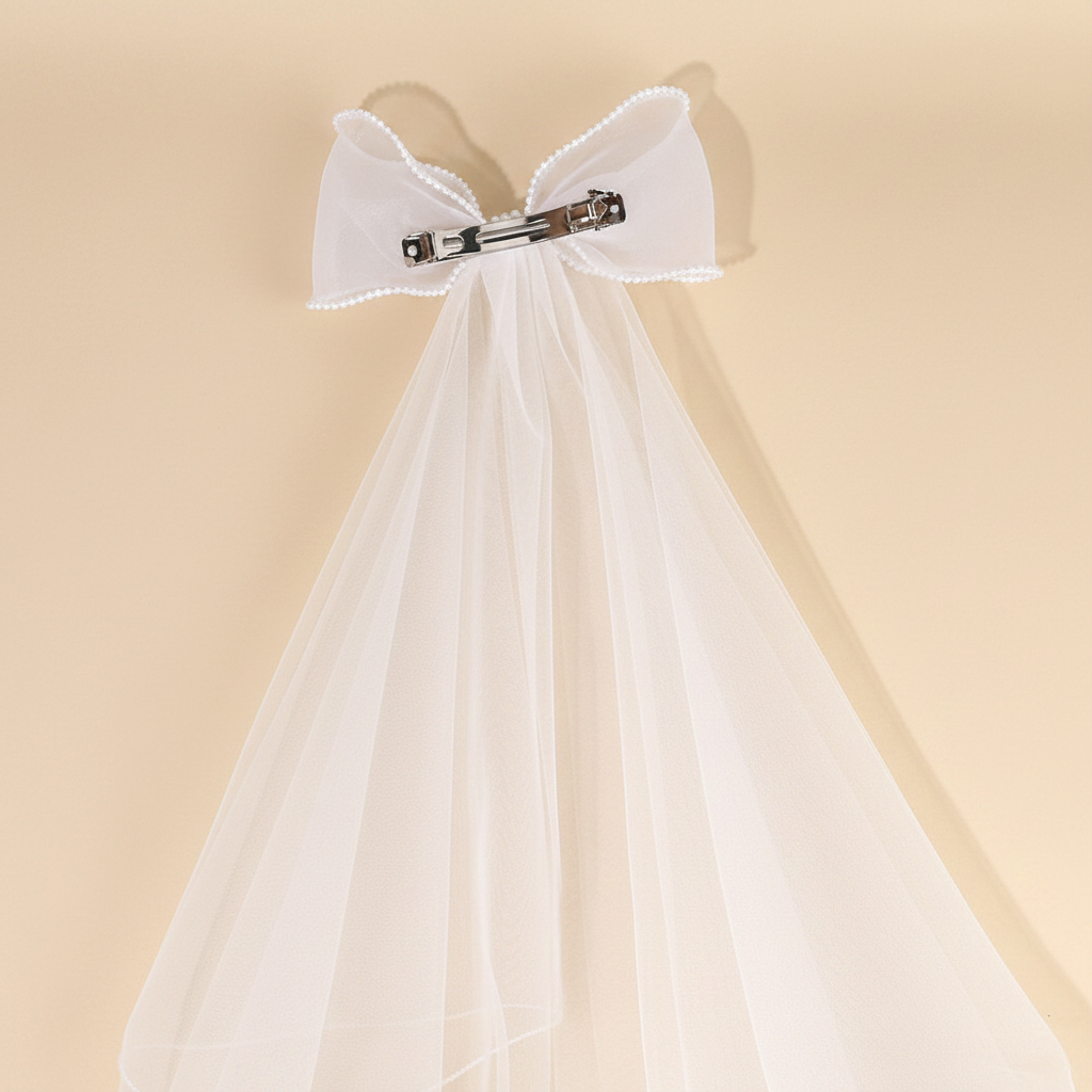 White tulle veil barrette with bow top and long sheer streamers